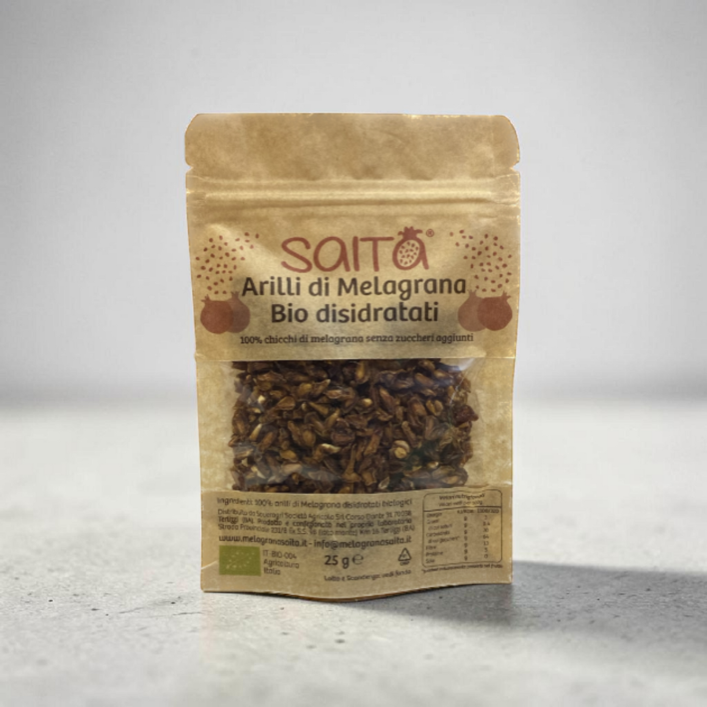 a packet of dried pomegranate arils in a light grey background