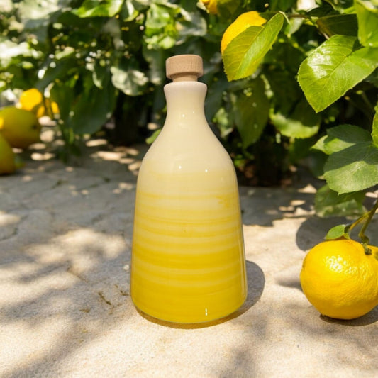 ceramic bottle in gradient yellow with a lemon tree in the background