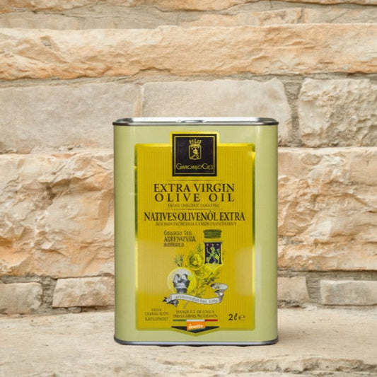 a tin of olive oil on a stone staircase