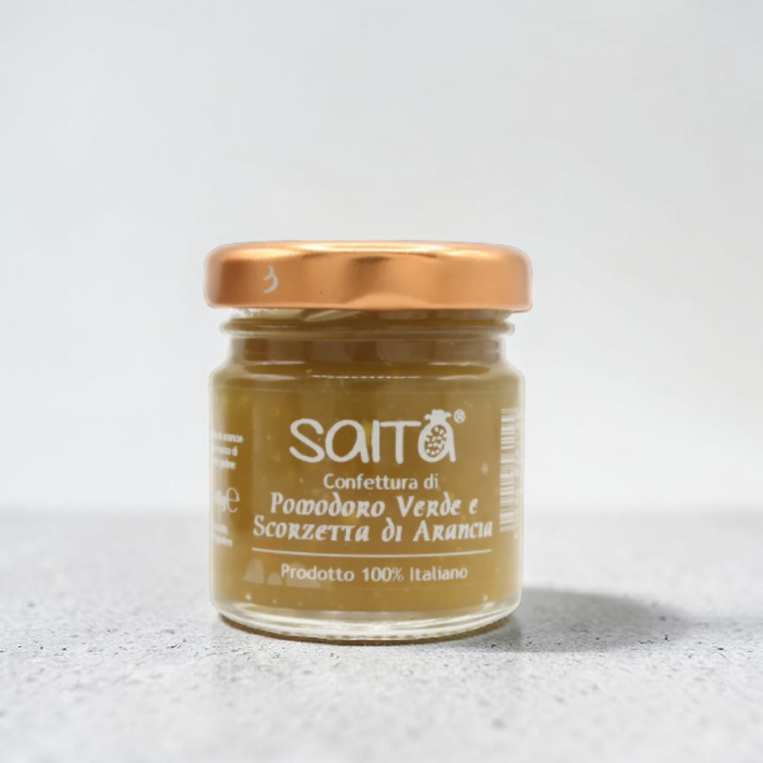 Jar of Saita confettura on a light gray background