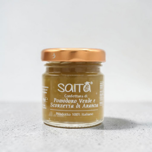 Jar of Saita confettura on a light gray background