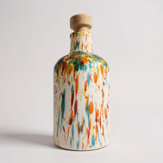 Ceramic bottle with a colourful design with a white background behind 