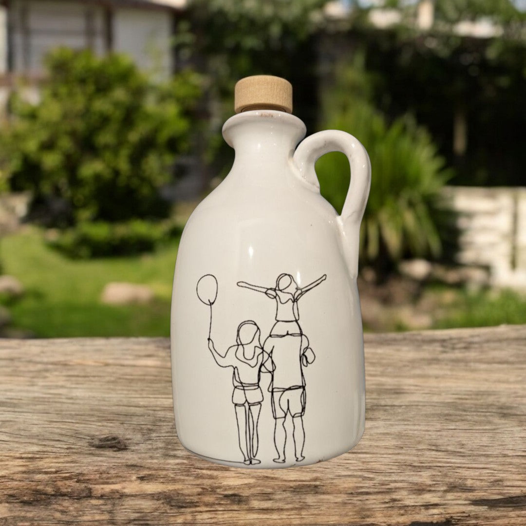 White ceramic bottle with a cork lid on a wooden surface outdoors