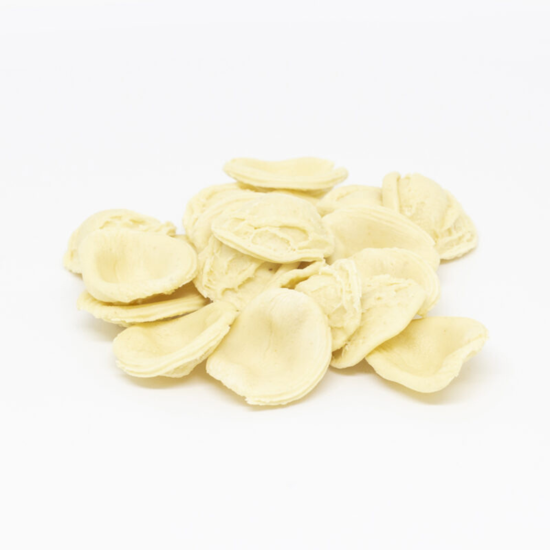 uncooked pasta orecchiette on a white background