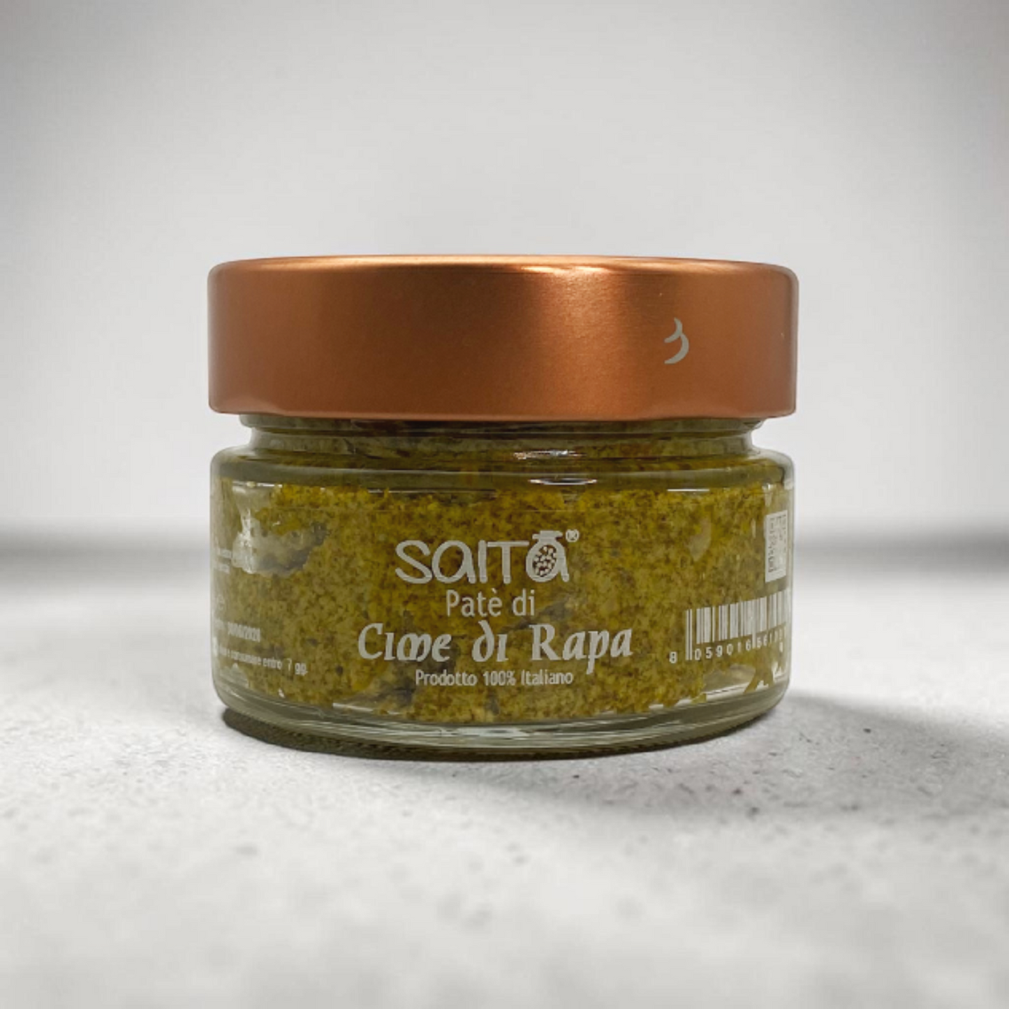 Jar of Saita pate cime di rapa on a grey background