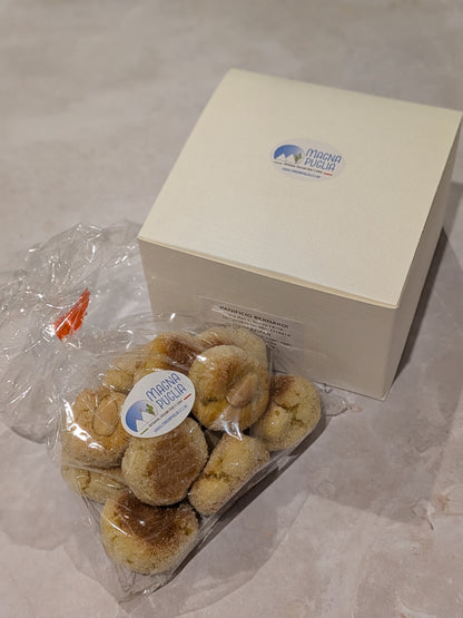 Packaged cookies with a branded box on a light surface